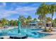 Beautiful community pool featuring comfortable lounge areas and lush greenery at 3838 Lana Ave, Davenport, FL 33897