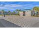 Sandy volleyball court next to a restroom building and community buildings at 3838 Lana Ave, Davenport, FL 33897