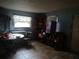 An indoor photo of living room showing table, chairs, and accessories at 405 N Oakland St, Leesburg, FL 34748