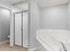 Bathroom featuring a glass door shower and a separate white tiled soaking tub at 408 Magpie Ct, Kissimmee, FL 34759