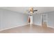 Spacious bedroom featuring tiled floors, a ceiling fan, and bright natural light at 408 Magpie Ct, Kissimmee, FL 34759
