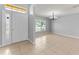 Inviting entryway featuring tile flooring, neutral paint, a ceiling light, and a large window offering lots of natural light at 408 Magpie Ct, Kissimmee, FL 34759