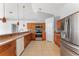 Well-equipped kitchen featuring wooden cabinets, stainless steel appliances, and ample counter space at 408 Magpie Ct, Kissimmee, FL 34759