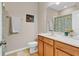 Bright bathroom features a vanity with a marble countertop, a large mirror, and a painted duck artwork at 458 Ellis Square Ct, Sanford, FL 32771