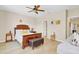 This bedroom includes wood floors, neutral walls, ceiling fan, and lots of natural light at 458 Ellis Square Ct, Sanford, FL 32771