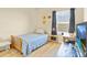 Bedroom with a single bed, desk with rolling chair, and a large window at 458 Ellis Square Ct, Sanford, FL 32771
