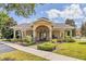 Community center with covered seating, landscaped surroundings, and parking at 458 Ellis Square Ct, Sanford, FL 32771
