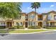 Well-maintained townhome with manicured landscaping and inviting exterior features at 458 Ellis Square Ct, Sanford, FL 32771