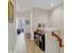 Upstairs hallway features a bookshelf and access to bedrooms and bathrooms at 458 Ellis Square Ct, Sanford, FL 32771