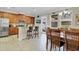 Spacious kitchen with breakfast bar, dining area, tile floors, stainless appliances and ample cabinet space at 458 Ellis Square Ct, Sanford, FL 32771