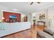 Inviting living room featuring hardwood floors, a comfortable sofa, and a warm, cozy ambiance at 458 Ellis Square Ct, Sanford, FL 32771