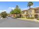 Quiet street view showcasing the townhomes with mature trees and well-kept landscaping at 458 Ellis Square Ct, Sanford, FL 32771