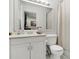 This bathroom features a large mirror, modern fixtures, and a shower at 4646 Old Road 37, Lakeland, FL 33813