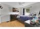 This bedroom features a large flat-screen television and natural lighting at 4646 Old Road 37, Lakeland, FL 33813
