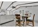 Dining room with beamed ceilings, sliding glass doors, and seamless living space at 4646 Old Road 37, Lakeland, FL 33813