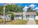 Charming single-story home with a well-maintained front yard and mature palm trees adding a tropical touch at 4646 Old Road 37, Lakeland, FL 33813