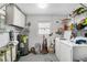 Bright laundry room with washer, dryer, and ample storage space at 4646 Old Road 37, Lakeland, FL 33813