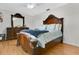 This main bedroom features a large bed and a decorative vanity at 4646 Old Road 37, Lakeland, FL 33813