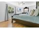 This bedroom features natural light, a ceiling fan, and luxury vinyl flooring at 4646 Old Road 37, Lakeland, FL 33813
