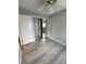 This bedroom features neutral gray walls and light wood-look flooring, creating a cozy and modern space at 4706 Sutton Ter # 111A2, Orlando, FL 32811