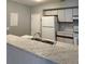 Open kitchen layout featuring breakfast bar with marble countertop and stainless steel sink at 4706 Sutton Ter # 111A2, Orlando, FL 32811