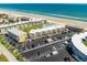 Picturesque aerial view showcasing the condo complex's beach access and ample parking at 4821 Saxon Dr # 201B, New Smyrna Beach, FL 32169