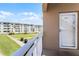 Balcony with a view of the community grounds and building exterior at 4821 Saxon Dr # 201B, New Smyrna Beach, FL 32169