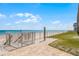 Convenient beach access with shower and walkway, enhancing the coastal lifestyle at 4821 Saxon Dr # 201B, New Smyrna Beach, FL 32169