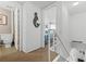 Hallway leading to a bathroom and bedroom featuring a nautical mermaid decoration on the wall at 4821 Saxon Dr # 201B, New Smyrna Beach, FL 32169