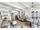 Open-concept living space featuring comfortable furnishings, a dining area, and a view into the kitchen at 4821 Saxon Dr # 201B, New Smyrna Beach, FL 32169