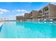 A refreshing swimming pool provides a relaxing retreat with ocean views at the condo complex at 4821 Saxon Dr # 201B, New Smyrna Beach, FL 32169