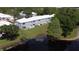 Aerial shot of the townhome's lakeside backyard and lawn at 4917 Walden Cir, Orlando, FL 32811