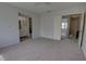 This bedroom is spacious with a view of the outdoors and an ensuite bathroom at 4917 Walden Cir, Orlando, FL 32811