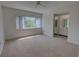 This bedroom is spacious with a view of the outdoors and an ensuite bathroom at 4917 Walden Cir, Orlando, FL 32811