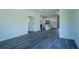 Spacious living room featuring hardwood floors, neutral colors, and an open layout at 5 Fisher Loop, Ocklawaha, FL 32179