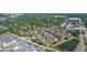 An aerial view of homes near greenway, roadways, and retail at 5412 Factors Walk Dr, Sanford, FL 32771