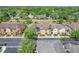 A high-angle aerial view of the community's townhomes, landscaping, and parking at 5412 Factors Walk Dr, Sanford, FL 32771
