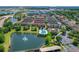 A beautiful aerial view of a complex with pond, fountain and pool at 5412 Factors Walk Dr, Sanford, FL 32771