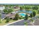 Aerial view of the community clubhouse, pool, pond, and lush landscaping at 5412 Factors Walk Dr, Sanford, FL 32771