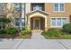 Exterior view of property entrance with a walkway and landscaping at 5412 Factors Walk Dr, Sanford, FL 32771
