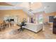 Large community lounge with ample seating, travertine floors, and kitchen access at 5412 Factors Walk Dr, Sanford, FL 32771