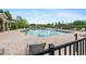 Community pool with sundeck and lounge chairs surrounded by manicured landscaping at 5412 Factors Walk Dr, Sanford, FL 32771