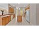 Traditional kitchen with an island, white appliances, tiled flooring, and ample cabinet storage at 602 Westview Dr, Minneola, FL 34715