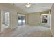 Spacious main bedroom with a ceiling fan, access to the pool, and a large window bringing in natural light at 602 Westview Dr, Minneola, FL 34715