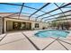 Covered screened pool with generous patio area and a landscaped garden, enhancing privacy and appeal at 602 Westview Dr, Minneola, FL 34715