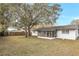 View of the backyard and the screened patio attached to the home at 621 Ashberry Ln, Altamonte Springs, FL 32714