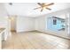 Open-concept living room with large windows, tile flooring, and bright lighting at 621 Ashberry Ln, Altamonte Springs, FL 32714