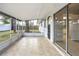 Enclosed back patio features tiled floors and a glimpse of the backyard at 621 Ashberry Ln, Altamonte Springs, FL 32714