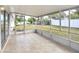 Enclosed patio with tiled floors offering a view of the fenced backyard at 621 Ashberry Ln, Altamonte Springs, FL 32714