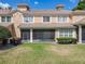 Backyard featuring screened in lanai and mature landscaping at 6240 Miramonte Dr # 102, Orlando, FL 32835